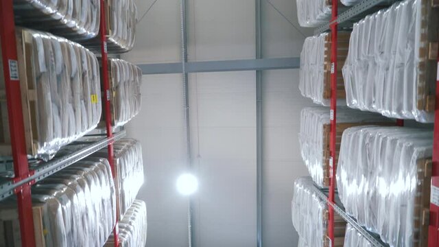aisle between the warehouse shelves