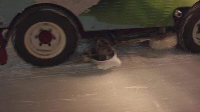 Ice resurfacer at night on ice.  A machine for polishing snow on ice in the city center on Christmas night.