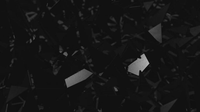 animation of minimalist black background with triangle pieces. Selective focus