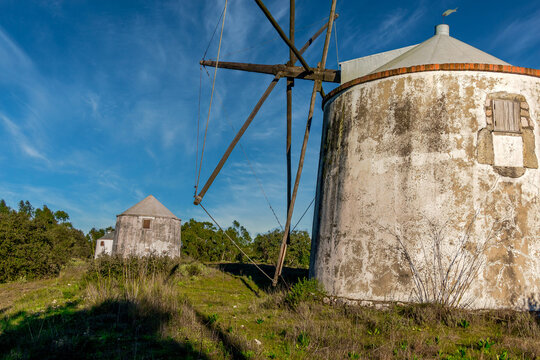 Old windmill in the middle of the mountain forest. Portuguese windmills called Moinhos da Pena