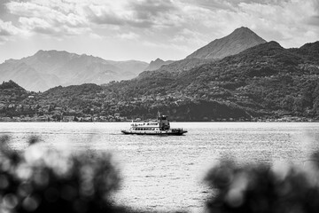 Small ferry sails on Lake Como
