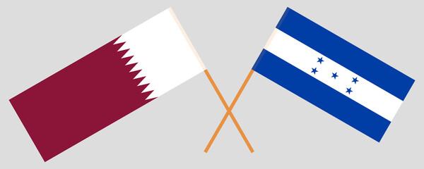 Crossed flags of Qatar and Honduras