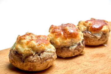 Champignons stuffed with cheese, chicken baked in the oven.