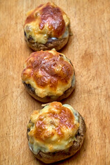 Champignons stuffed with cheese, chicken baked in the oven.