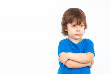 portrait of an offended boy on a light background