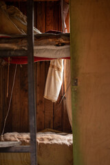 Abandoned trailer interior bunk beds and towel curtainss fabrics light dust in Bulgaria, Eastern Europe