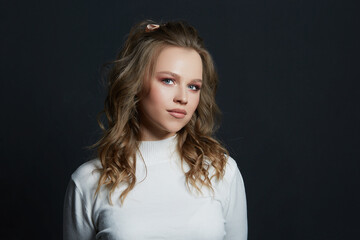 Fototapeta premium Portrait of beautiful woman model with fresh daily makeup and romantic wavy hairstyle