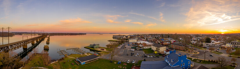 Aerial sunset panorama of Havre De Grace Harford County, Maryland, and the railroad bridge over the...