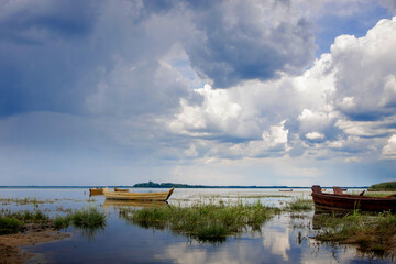 Fishing boat on the shore on lake