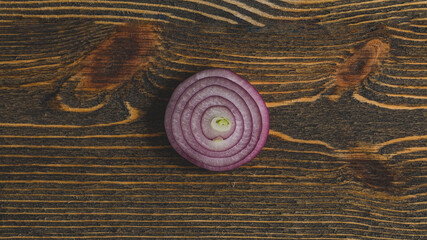 Fototapeta na wymiar Red onion on wooden boards