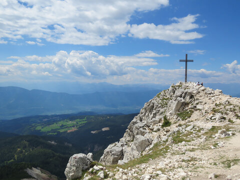A shot of a black cross at the peak of Corno Bianco mountain, Dolomites