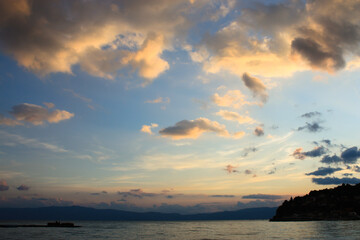 Fototapeta na wymiar Blue and pink cloudscape over Lake Ohrid in North Macedonia at sunset