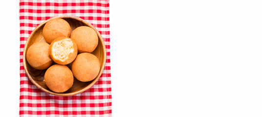 Traditional Colombian buñuelo - Deep Fried Cheese Bread. Wood table