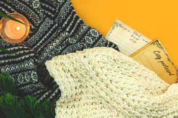 Winter holidays greeting card, postcards, cozy poster template, woolen and knitted sweater, candle, copy space