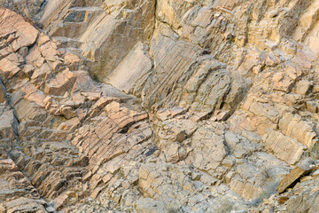 Patterns in blond colored rocks of the Titus Canyon Wall in Death Valley National Park, California, USA