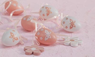 easter eggs.
Decorative Easter eggs with flowers on a pink background, close-up side view.