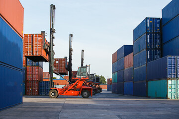 Container loading in container yard with container handlers. Container ship in import and export business logistic company. Business Logistics and Transportation concept.