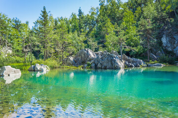 The Blue Lake (Lac bleu) in Champclause, Auvergne (France) is an old quarry that was flooded and is...