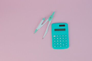 A top view of a calculator with a caliper - accuracy concept