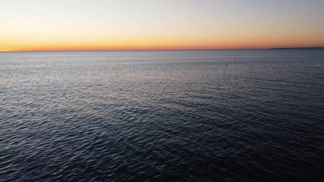 Beautiful Sunset in Portugal with seagulls flying by