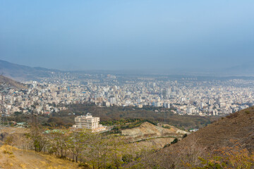 City view of Tehran City with dust and mist and modern buildings, Iran form Tohal mountain. Tochal is a popular recreational region for Tehran's residents