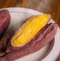 Japan Roasted Sweet Potato (yaki imo) on white plate smoked