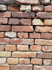 industrial background and texture of weathered ancient brown brick wall