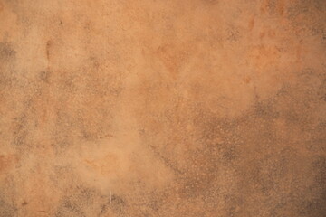 Closeup of the old parchment in warm vintage brown tone with stains for background and decoration