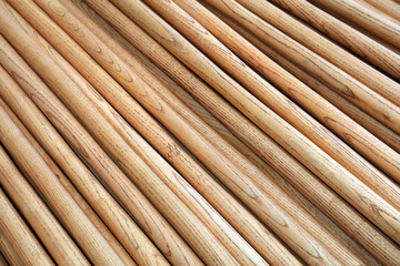 The wooden handles are stacked together in the factory.