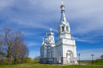 Fototapeta na wymiar Old Church of the Holy Martyr Queen Alexandra on a sunny May day. The village of Nizino. Leningrad region, Russia