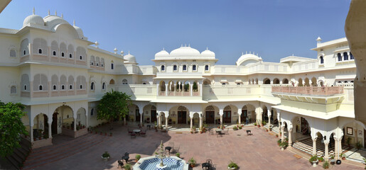 India, white airy architecture with arches and fountain
