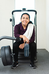 Fototapeta na wymiar A portrait of a young woman in the gym