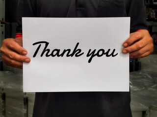 Selective focus on man holding board with thank you.Business concept.