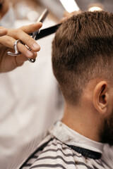 men have their hair cut at the barbershop