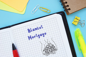 Financial concept meaning Blanket Mortgage with sign on the piece of paper.