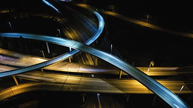 Drone Hyper Lapse of Freeway at Night witth Commuters Traveling at High Speed
