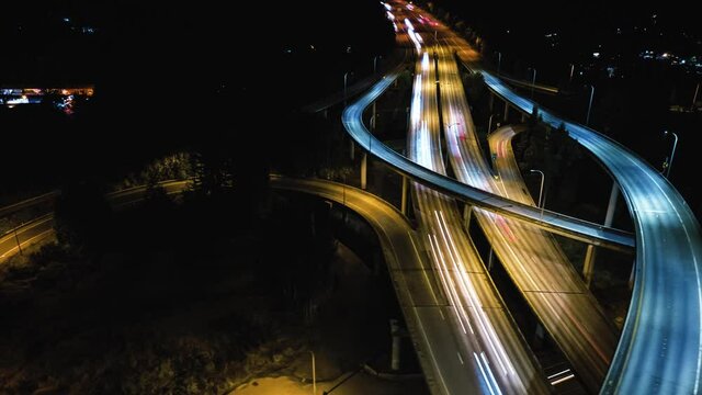 Cinematic Aerial Time Lapse Above Freeway Interchange Causing Climate Change from Carbon Emissions