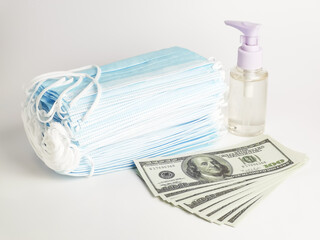 Photo of dollar bank notes with a bunch of mask and a bottle hand sanitizer.Covid-19 and business concept. 