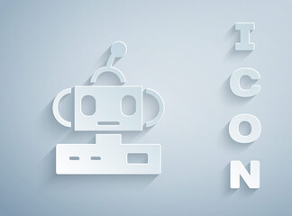 Paper cut Robot toy icon isolated on grey background. Paper art style. Vector.