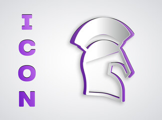 Paper cut Greek helmet icon isolated on grey background. Antiques helmet for head protection soldiers with a crest of feathers or horsehair. Paper art style. Vector.