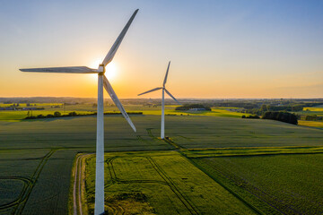 Wind turbines that produce electricity, built on a field in Skanderborg, Denmark