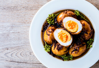 Fried hard boiled eggs in tamarind sauce or Kai Lug  Kuey , Thai famous food