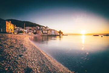 Moscenicka draga Istria in Croatia. Nice sea and beach photo with town and port. Nice clear sunrise...