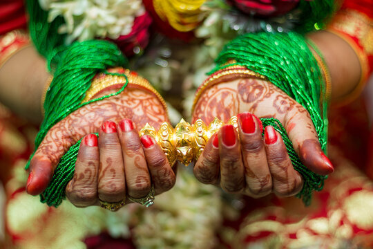 wedding ring and mehendi heena on hands from nepali wedding bride 