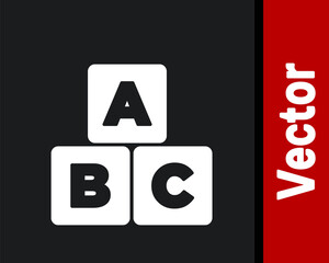 White ABC blocks icon isolated on black background. Alphabet cubes with letters A,B,C. Vector.