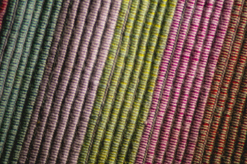 textured background  colored cotton threads diagonal