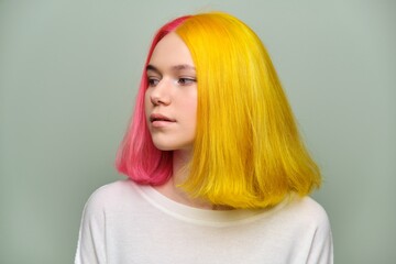 Headshot of fashionable beautiful teen girl with trendy dyed hair