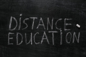 Fototapeta premium Distance Education words chalk hand drawn on blackboard