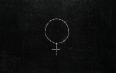 Fototapeta na wymiar Venus gender female symbol hand drawn in chalk on blackboard