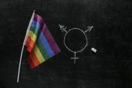 Rainbow flag and gender lgbt symbol drawn chalk on blackboard